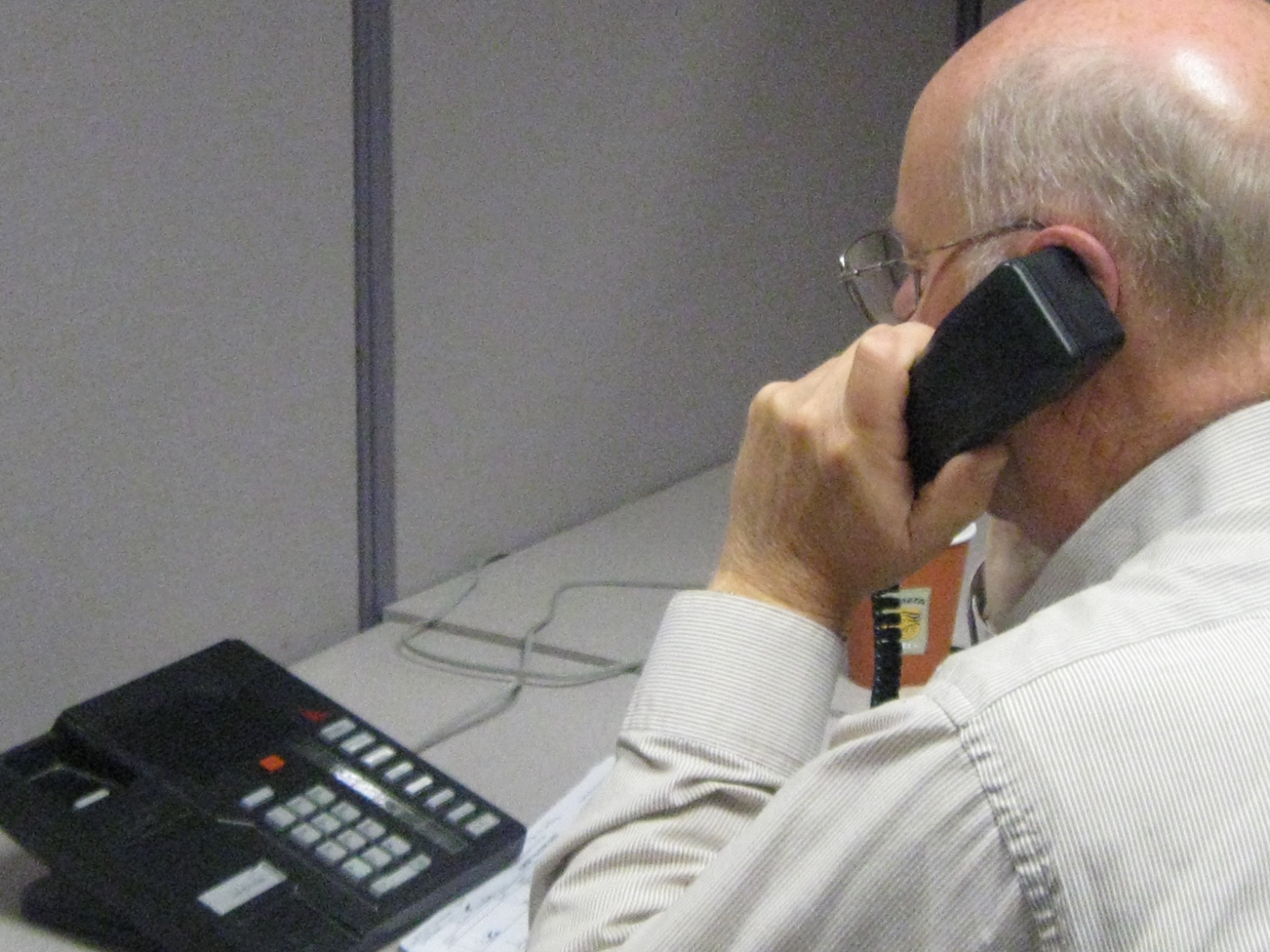 Image of a man answering a phone call