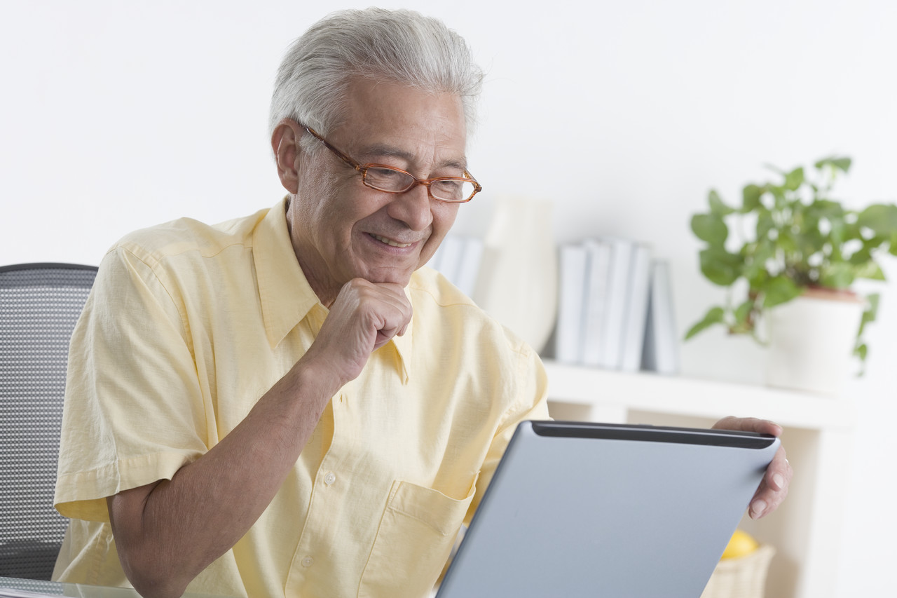 image of a person reading something on a laptop